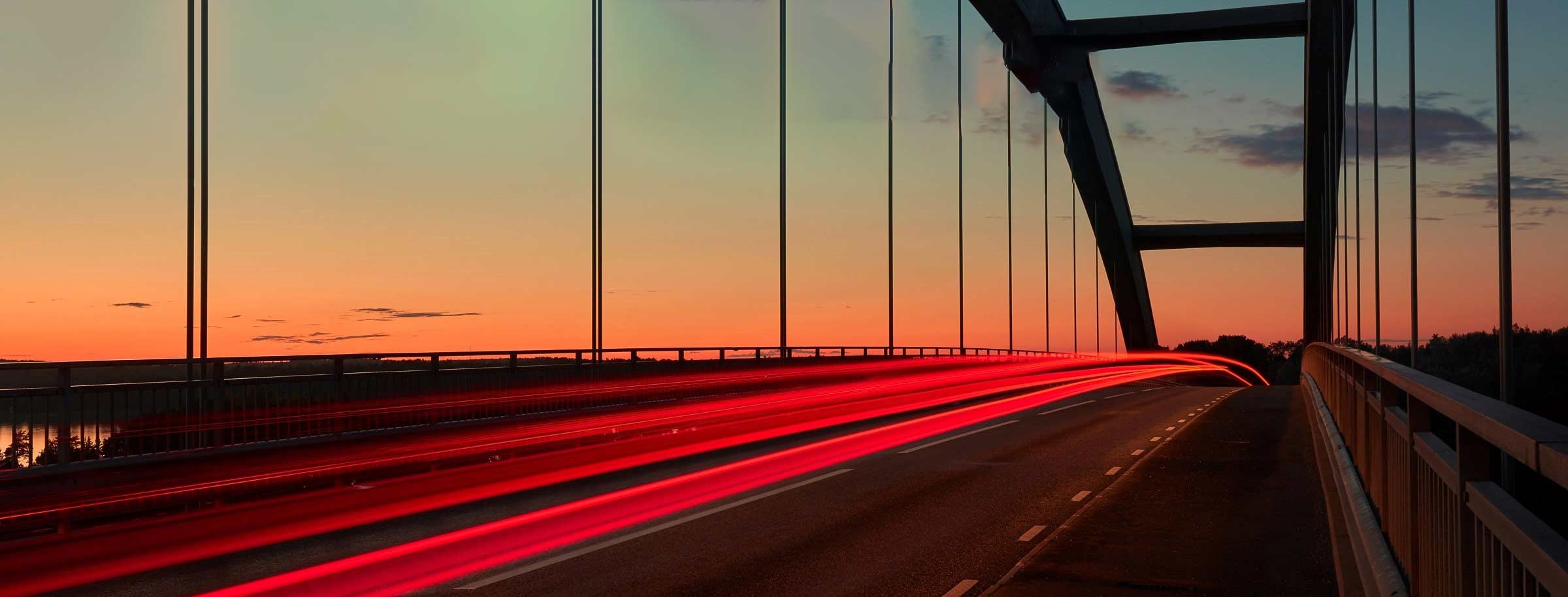 bridge with traffice at sunset